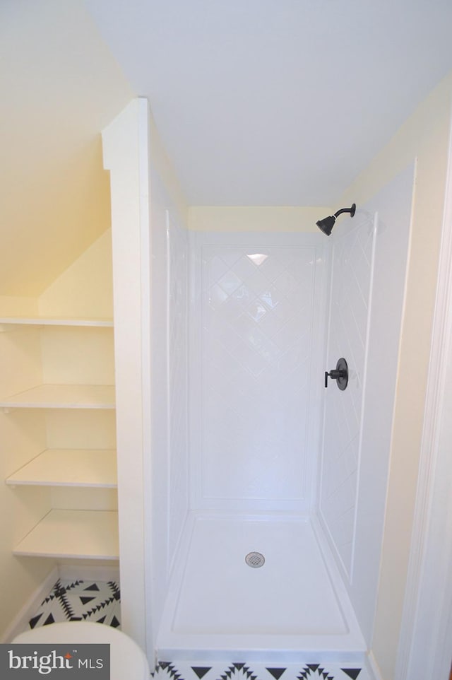 full bathroom with a tile shower