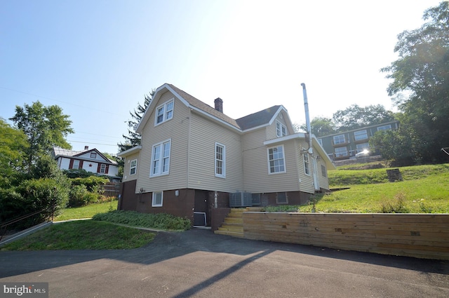 view of front of house featuring central air condition unit