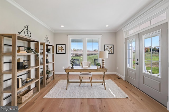 home office with french doors, light wood-type flooring, a wealth of natural light, and crown molding