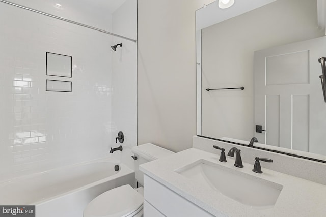 full bathroom with bathing tub / shower combination, vanity, and toilet