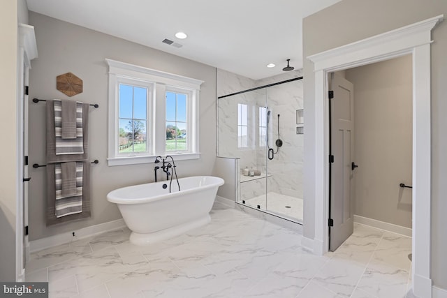 bathroom with a marble finish shower, baseboards, visible vents, marble finish floor, and a freestanding tub