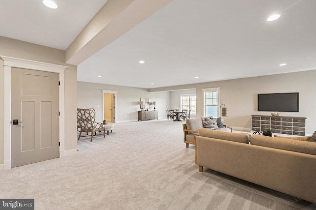 living room with baseboards, light colored carpet, and recessed lighting