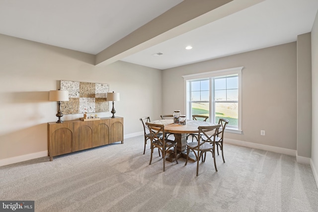 dining room featuring light carpet, beamed ceiling, recessed lighting, and baseboards