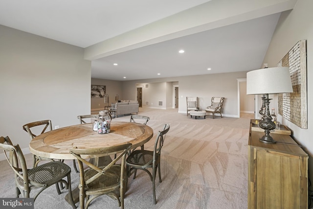 dining room with recessed lighting, light carpet, and baseboards