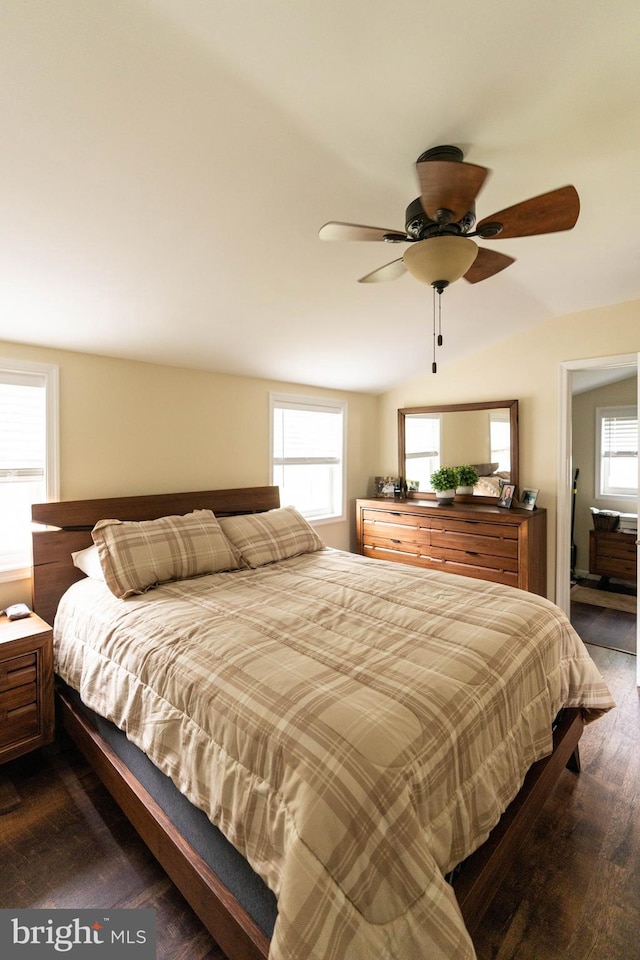 bedroom featuring multiple windows and ceiling fan