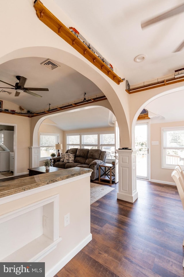 kitchen with dark wood-type flooring and ceiling fan