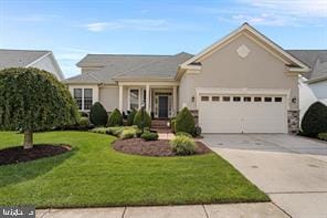 view of front of property featuring a garage and a front yard