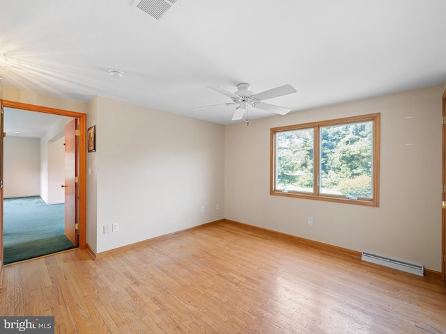 unfurnished room with baseboard heating, light wood-type flooring, and ceiling fan