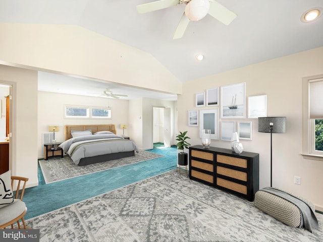 carpeted bedroom featuring lofted ceiling and ceiling fan