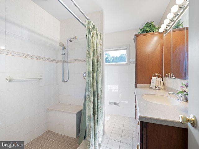 bathroom featuring curtained shower and vanity