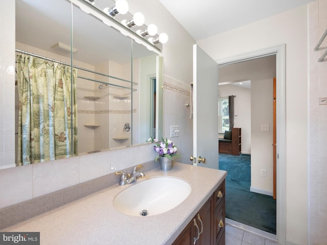 bathroom featuring a shower with shower curtain, tile patterned flooring, and vanity