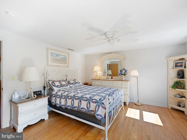 bedroom featuring light wood-type flooring and ceiling fan