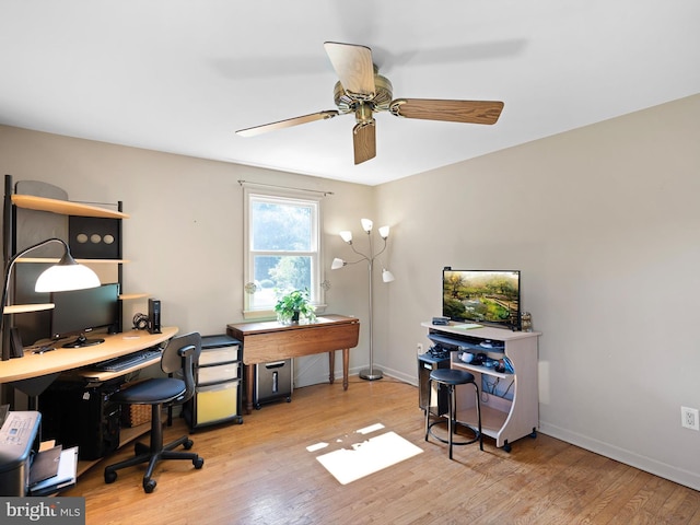 office featuring light wood-type flooring and ceiling fan