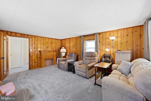 living room featuring light carpet and wooden walls