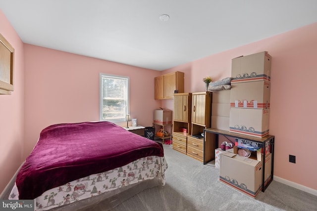 bedroom featuring light colored carpet