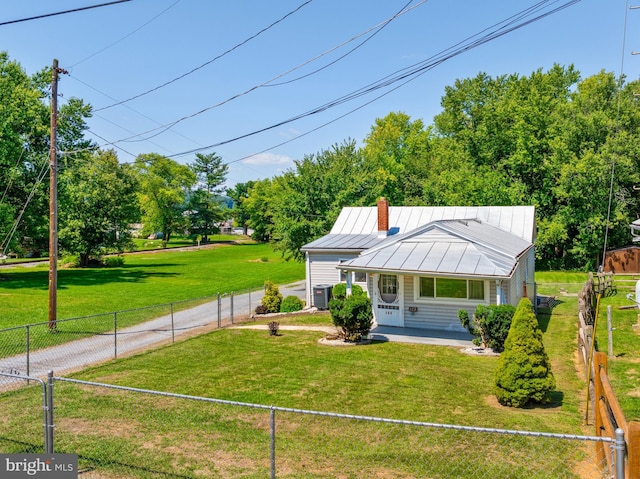 bungalow-style house with a fenced front yard and a front lawn