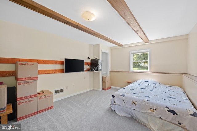 bedroom featuring beam ceiling, visible vents, light carpet, and baseboards