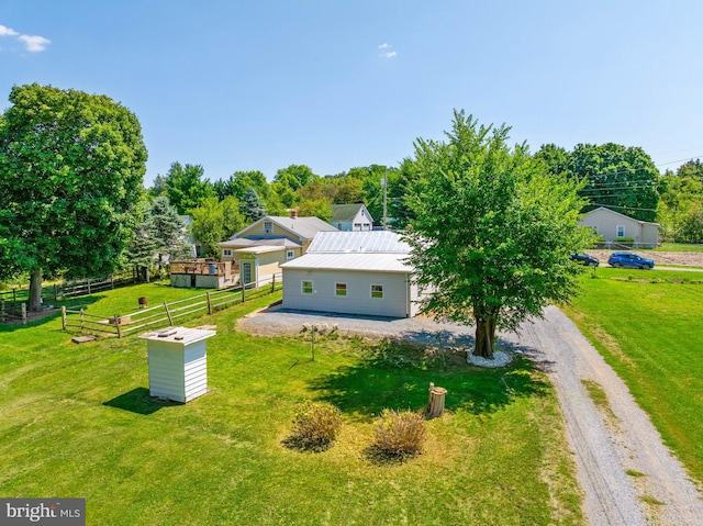 exterior space featuring a rural view and a front yard