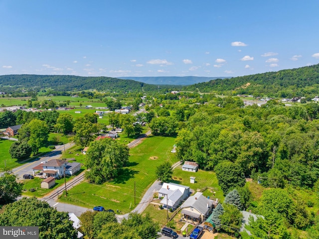 birds eye view of property featuring a wooded view and a residential view