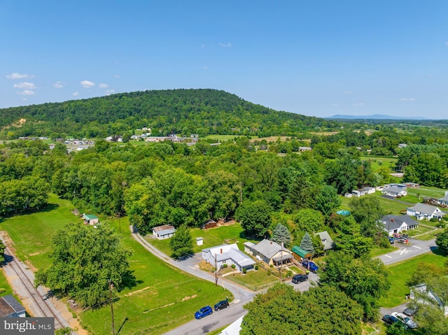 birds eye view of property with a forest view