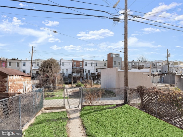 view of yard featuring a gate and fence