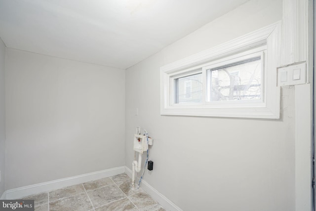 laundry room with laundry area and baseboards