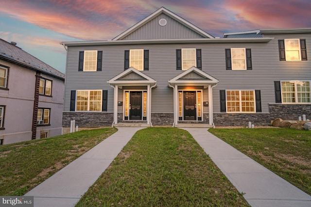 view of front of home with a yard