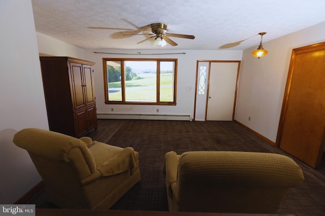 living room featuring a textured ceiling, ceiling fan, and a baseboard radiator