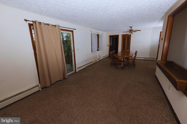 interior space featuring a textured ceiling, baseboard heating, and dark colored carpet