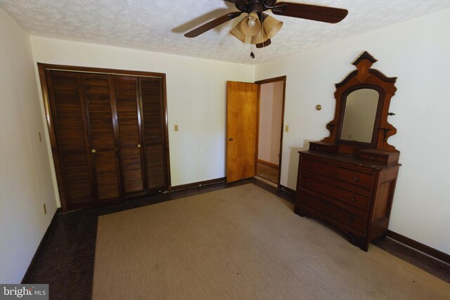 carpeted bedroom featuring a textured ceiling, ceiling fan, and a closet