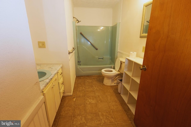 full bathroom featuring tile patterned floors, shower / washtub combination, vanity, and toilet