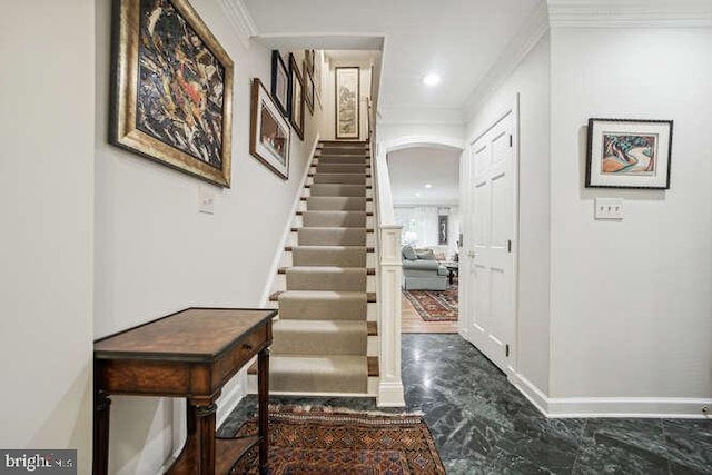 foyer featuring ornamental molding