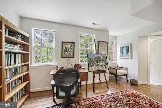 office with hardwood / wood-style flooring