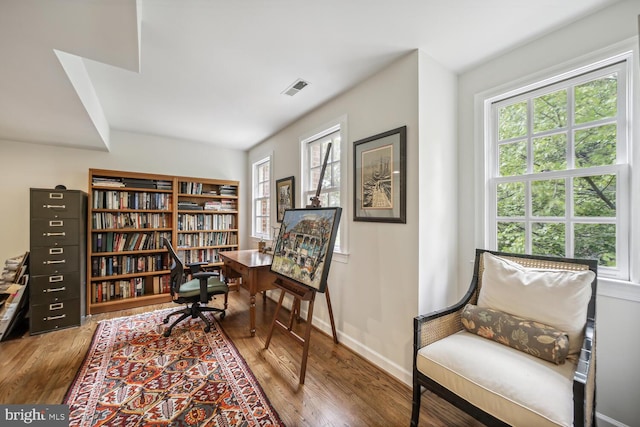 living area with hardwood / wood-style floors