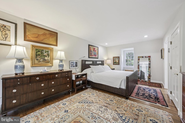 bedroom featuring dark hardwood / wood-style flooring