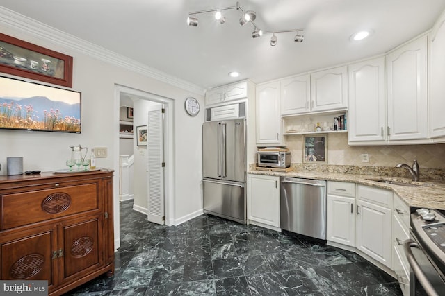 kitchen with sink, white cabinets, and stainless steel appliances