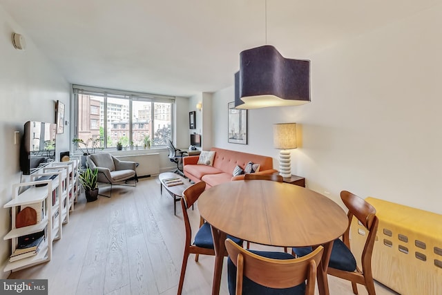 dining room featuring light wood-style floors