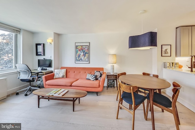 living room featuring baseboards