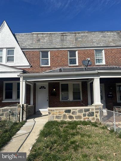 view of property featuring covered porch