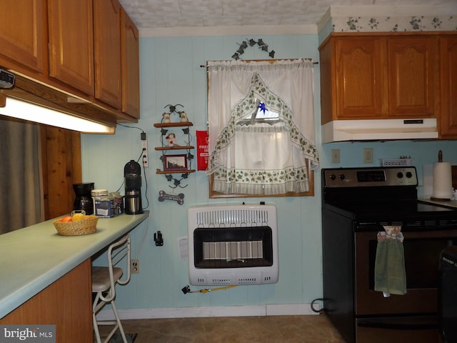 kitchen featuring electric stove, heating unit, and tile patterned flooring