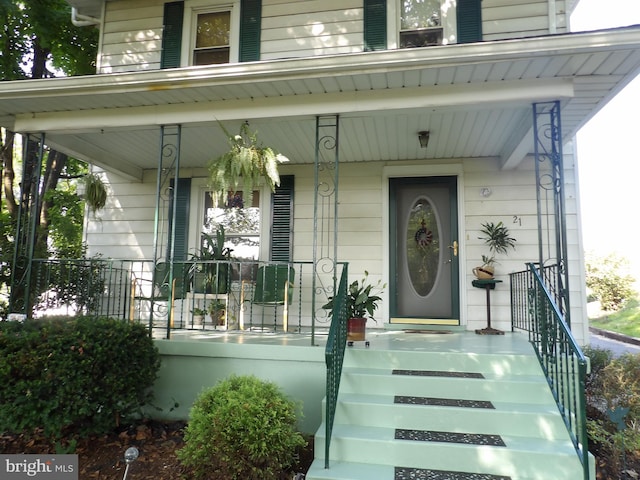 entrance to property with a porch