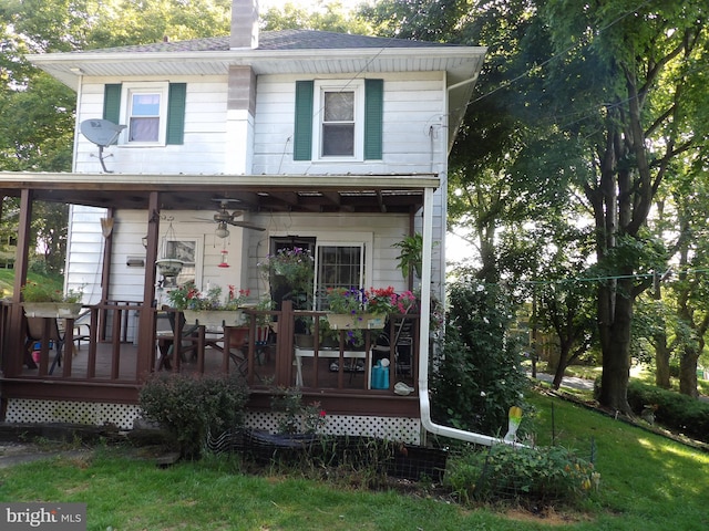 rear view of house with a lawn