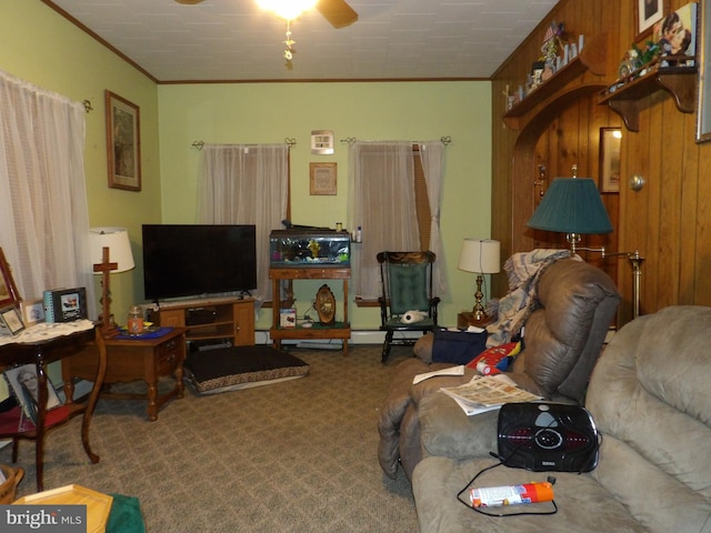 living room with carpet flooring, ornamental molding, and ceiling fan