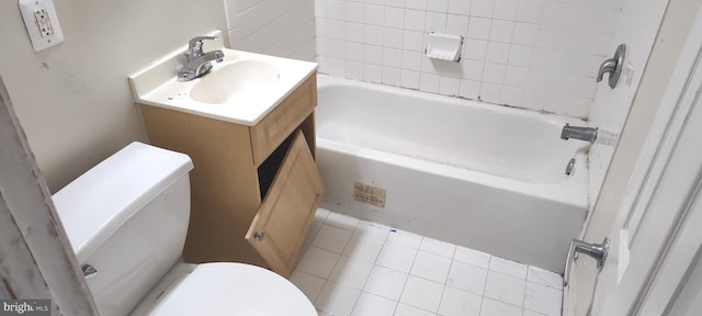 bathroom with vanity, toilet, and tile patterned flooring