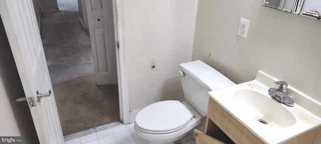 bathroom with vanity, toilet, and tile patterned flooring