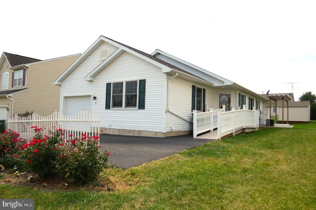 view of front of property with a garage and a front yard