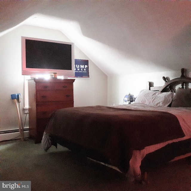 carpeted bedroom featuring vaulted ceiling and a baseboard heating unit