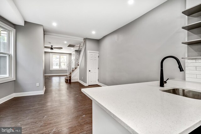 kitchen featuring dark hardwood / wood-style floors, gray cabinets, sink, and stainless steel appliances