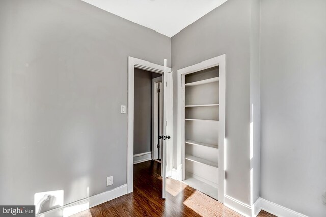 interior space with hardwood / wood-style flooring and a closet