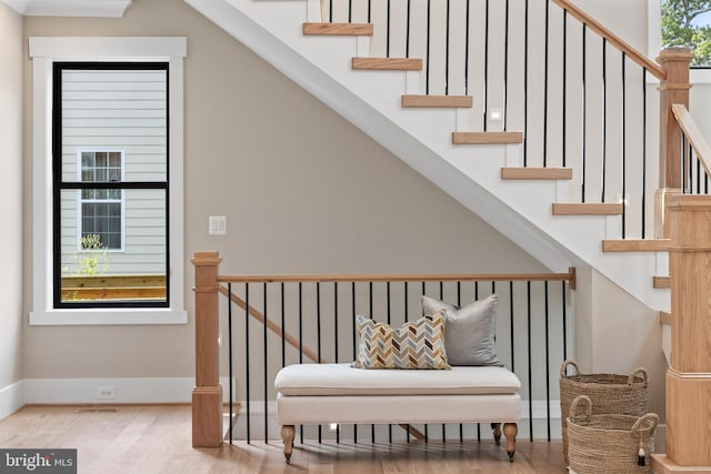 stairs with baseboards and wood finished floors